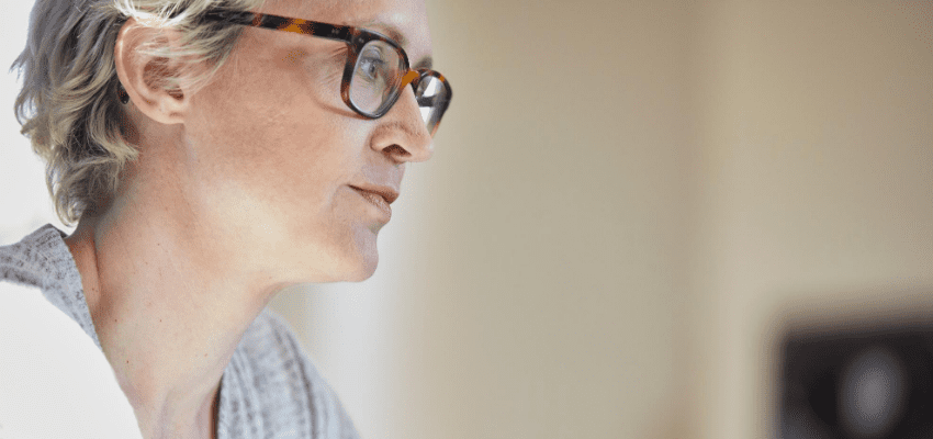 Woman in glasses working